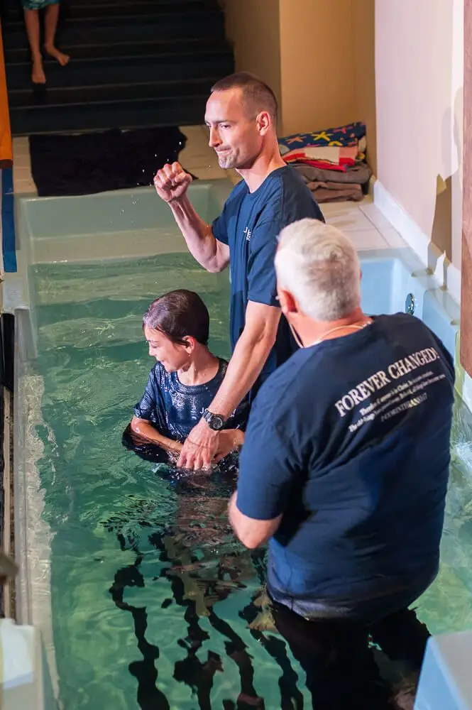 Young Boy Being Baptized